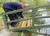 fitting deck boards to bridge